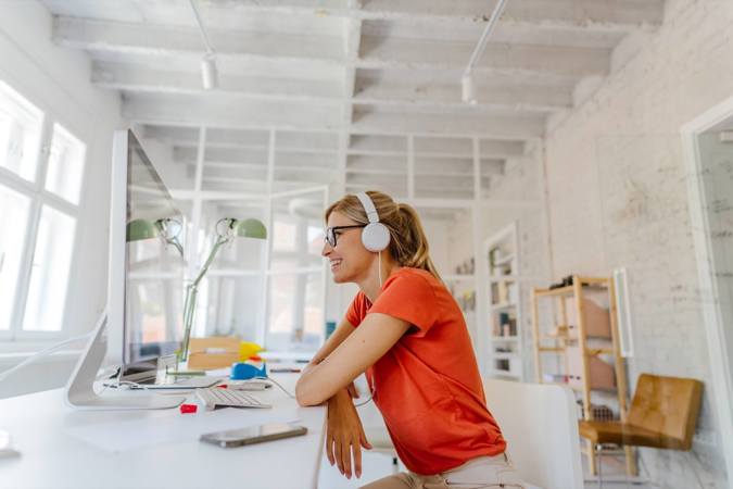 Woman working from home taking part in a meeting.