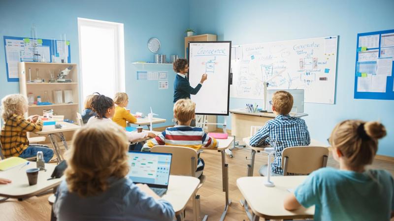 Students following a microlearning lesson in the classroom.